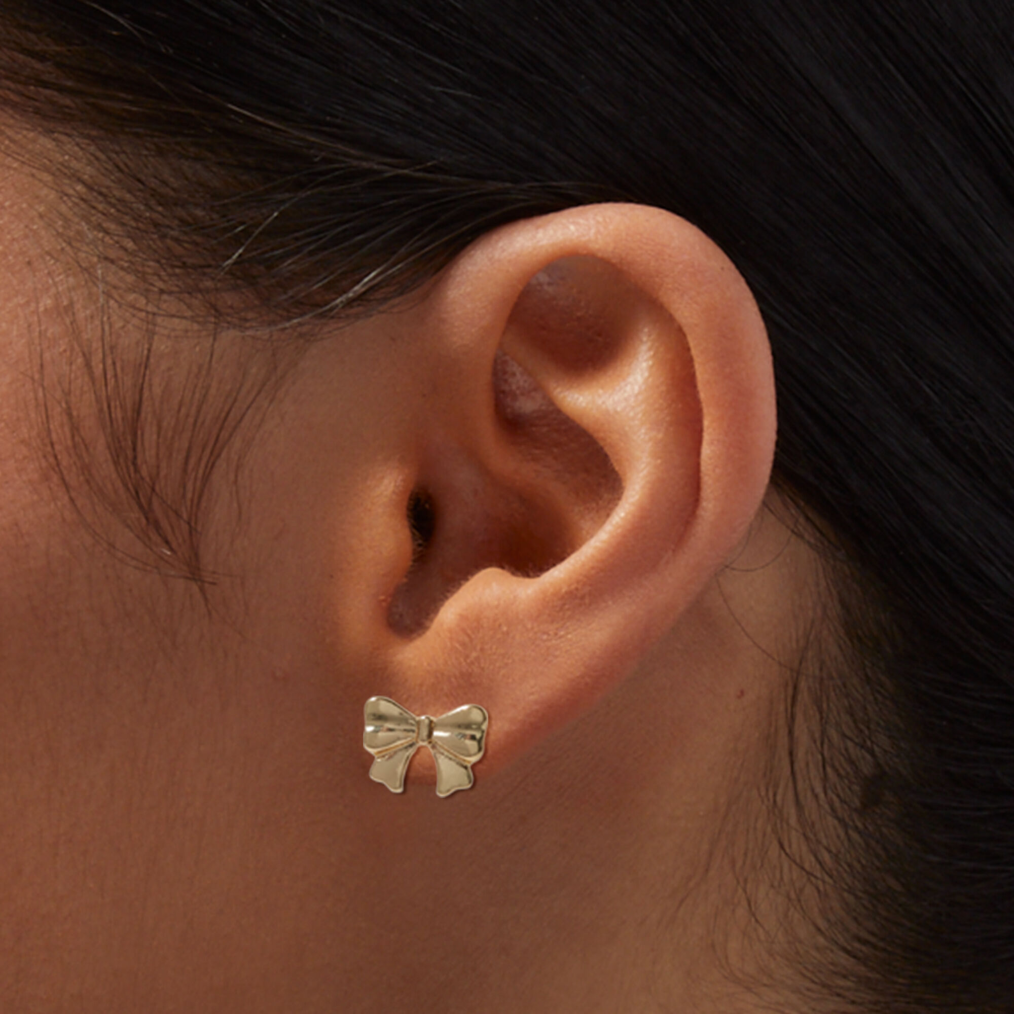 Gold bow new arrivals earrings studs