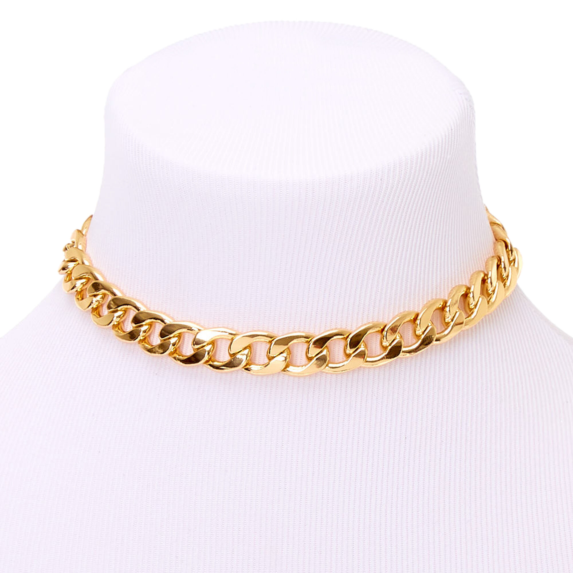 black bag with chunky gold chain
