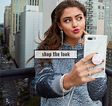 rooftop woman taking a selfie with her phone