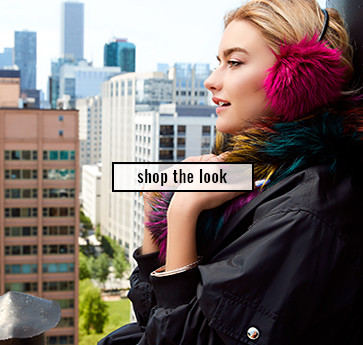 woman with bright earmuffs and multicolored fur snood